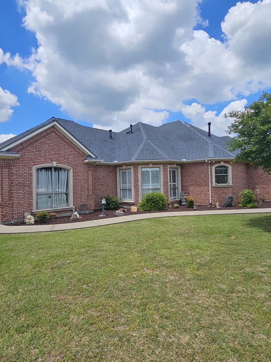 Brick ranch with new roof installation in Johnson County, TX