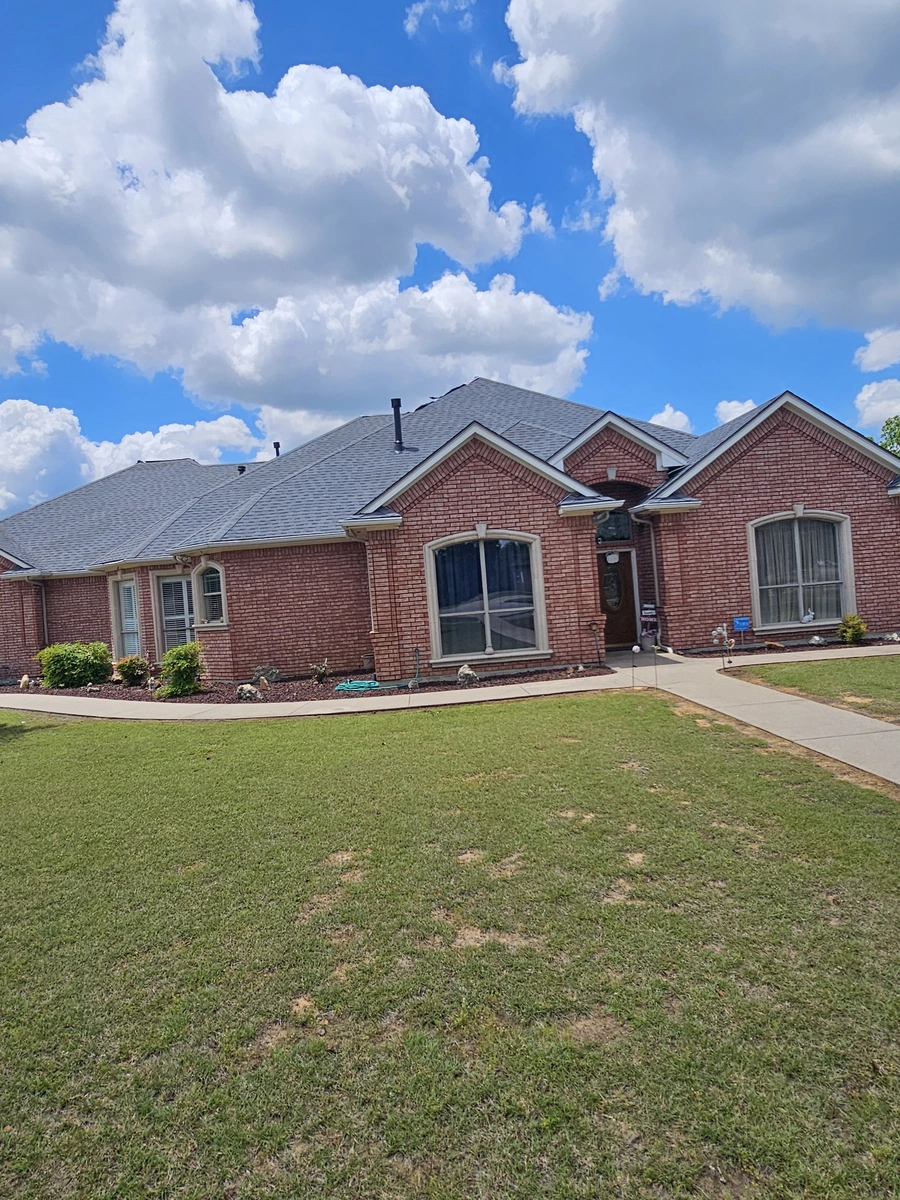 Roof installation on brick home in Johnson County, TX by My Roofing