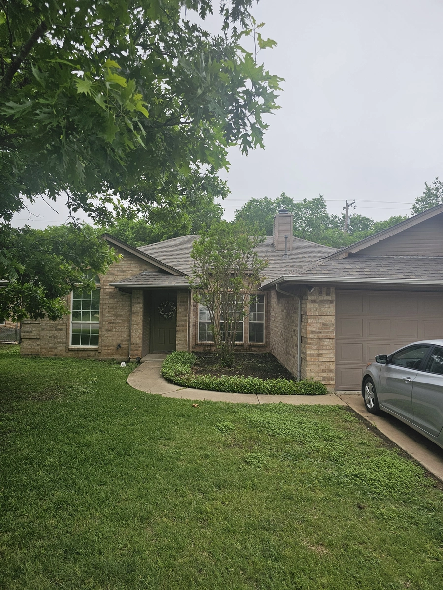 Front view of new roof installation in Cleburne, TX by My Roofing